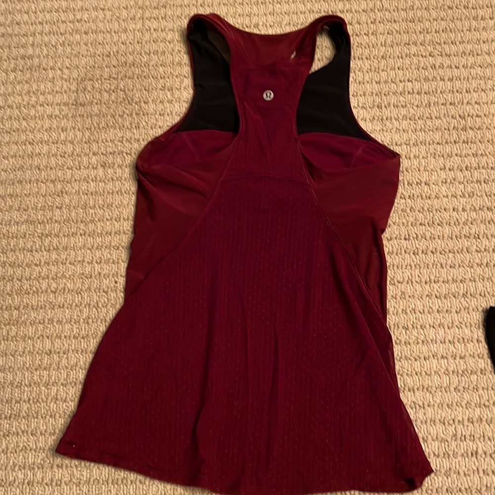 Excellent - like new. Size 4 Lululemon tank with built in light support